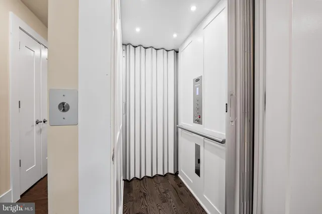 a view of entryway with stairs and wooden floor