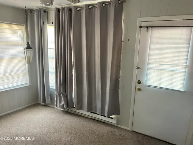 a view of a room with windows