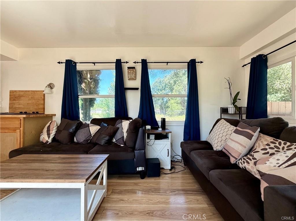 7665 Cache Creek Way Clearlake, CA 95422 - Photo 14 of 41 a living room with furniture and large windows