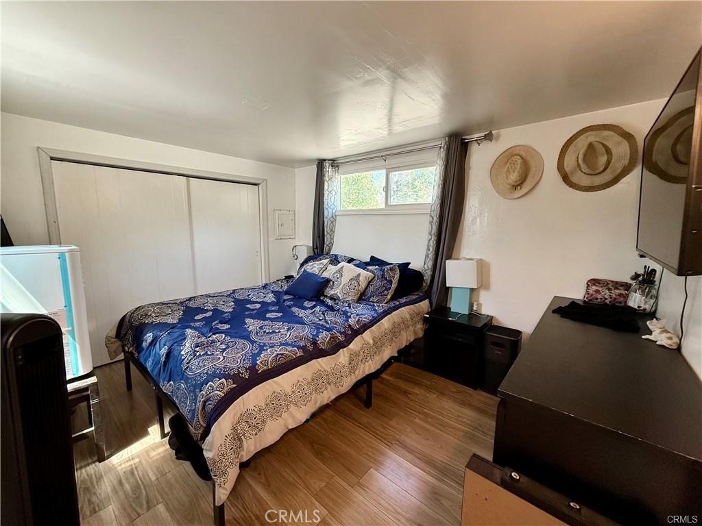 7665 Cache Creek Way Clearlake, CA 95422 - Photo 19 of 41 a bedroom with a bed and a window