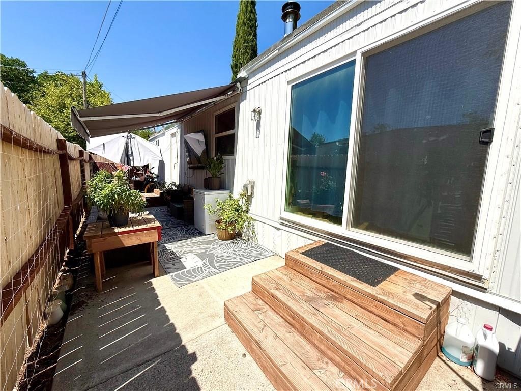 7665 Cache Creek Way Clearlake, CA 95422 - Photo 6 of 41 a balcony with furniture and a potted plant