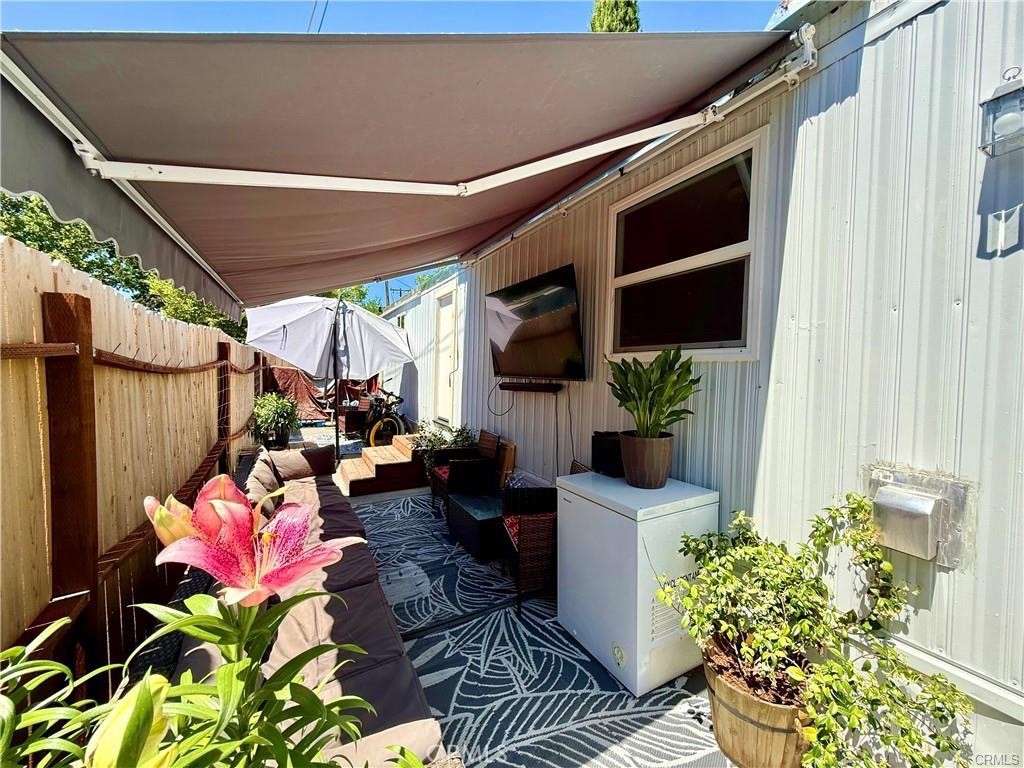 7665 Cache Creek Way Clearlake, CA 95422 - Photo 7 of 41 a potted plant sitting in front of a house