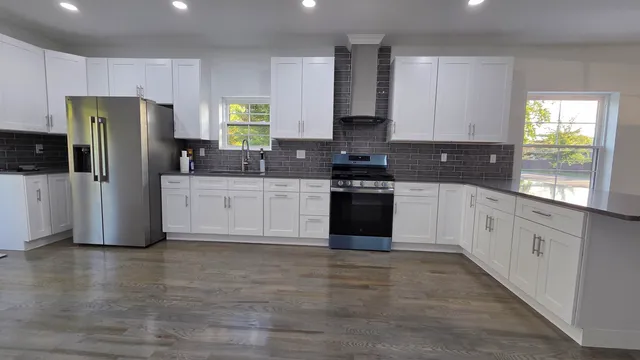 a view of a room with wooden floor