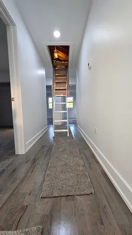 a view of empty room with wooden walls