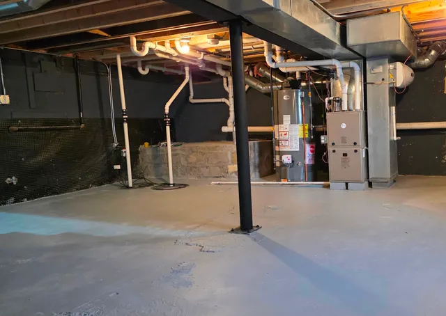 a view of staircase with lots of frames on wall