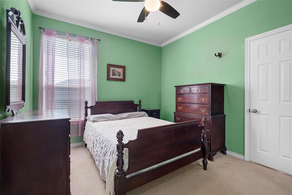 2114 Trace Ridge Drive Weatherford, TX 76087 - Photo 11 of 14 a bed sitting in a bedroom next to a window