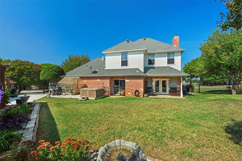 2114 Trace Ridge Drive Weatherford, TX 76087 - Photo 13 of 14 a front view of a house with a garden