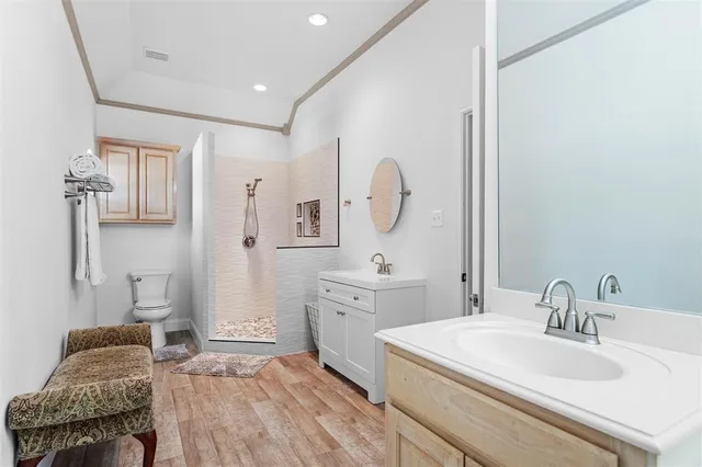 a spacious bathroom with a sink and a mirror
