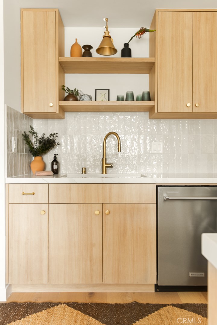 334 Gladys Avenue, Unit 305 Long Beach, CA 90814 - Photo 12 of 26 a kitchen with a sink a stove and cabinets