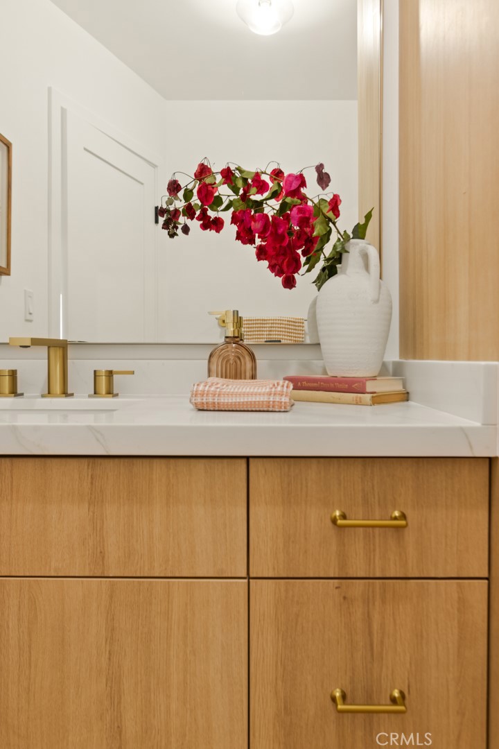 334 Gladys Avenue, Unit 305 Long Beach, CA 90814 - Photo 14 of 26 a bathroom with a sink and a mirror