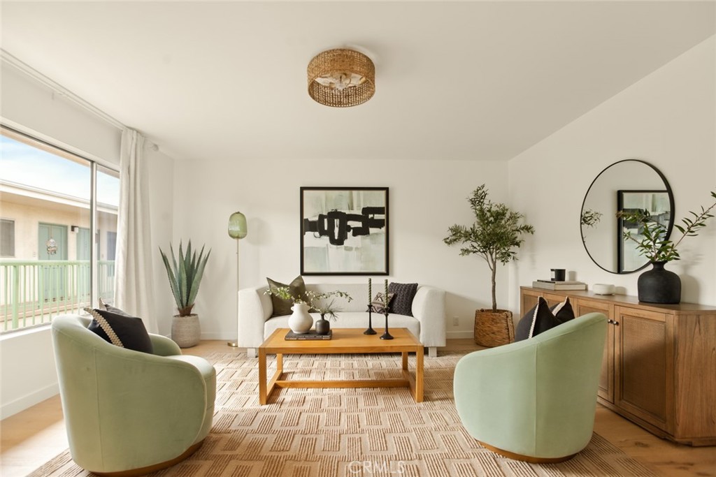 334 Gladys Avenue, Unit 305 Long Beach, CA 90814 - Photo 3 of 26 a living room with furniture and a large window