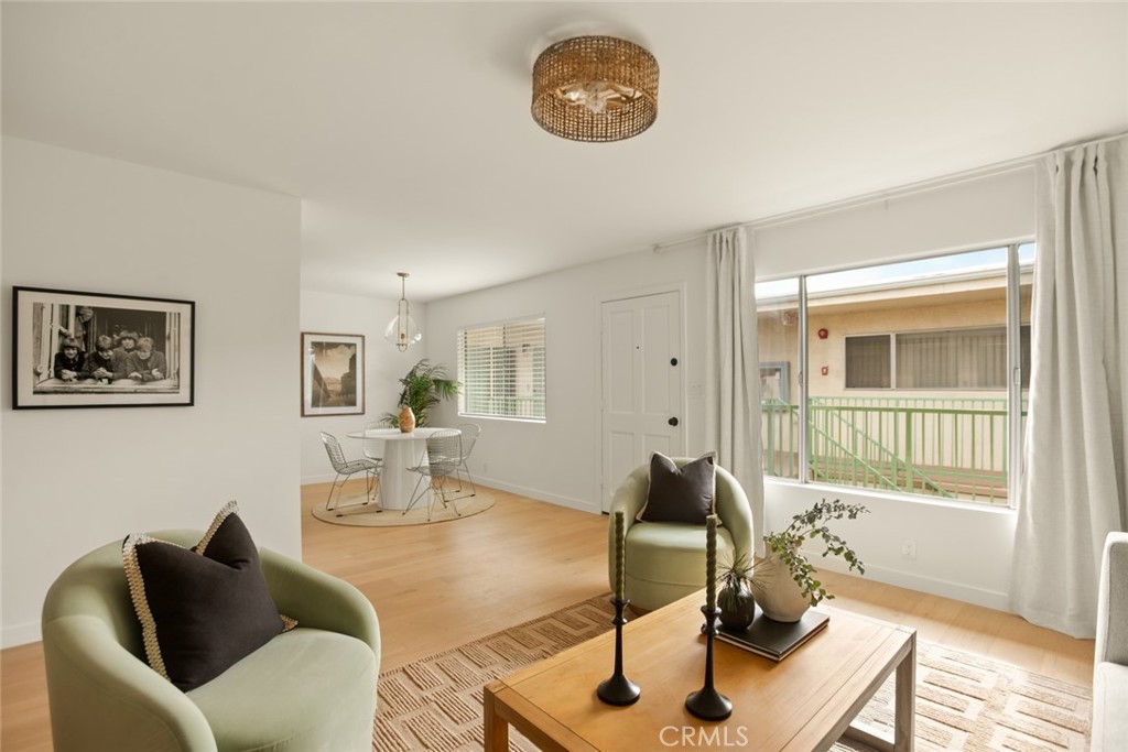 334 Gladys Avenue, Unit 305 Long Beach, CA 90814 - Photo 6 of 26 a living room with furniture a window and a table