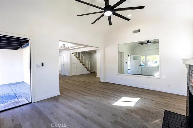 a view of kitchen with cabinets and wooden floor