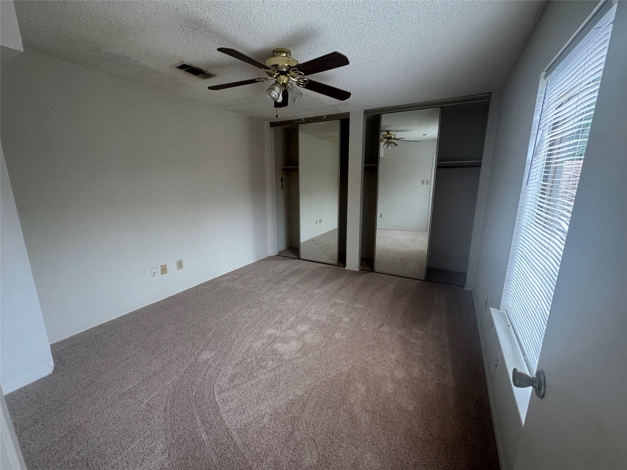 3020 Windchase Boulevard Houston, TX 77082 - Photo 12 of 16 a view of an empty room with a window