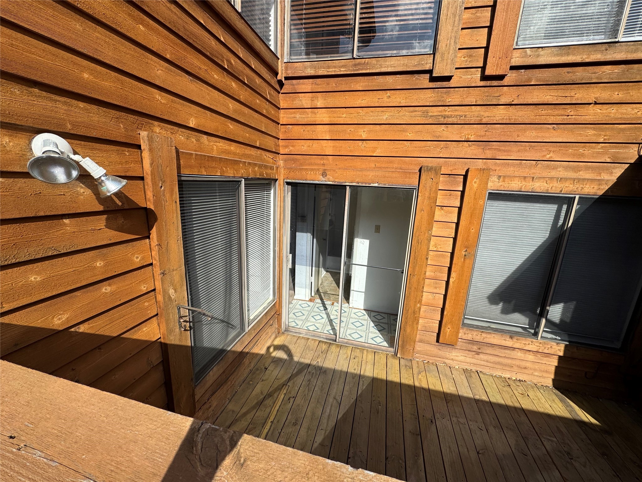 3020 Windchase Boulevard Houston, TX 77082 - Photo 14 of 16 a view of a balcony with wooden floor and stairs