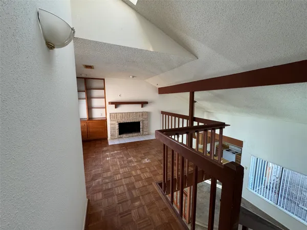 a view of livingroom with furniture fireplace and window