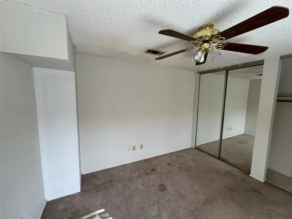 a view of a balcony with wooden floor and stairs