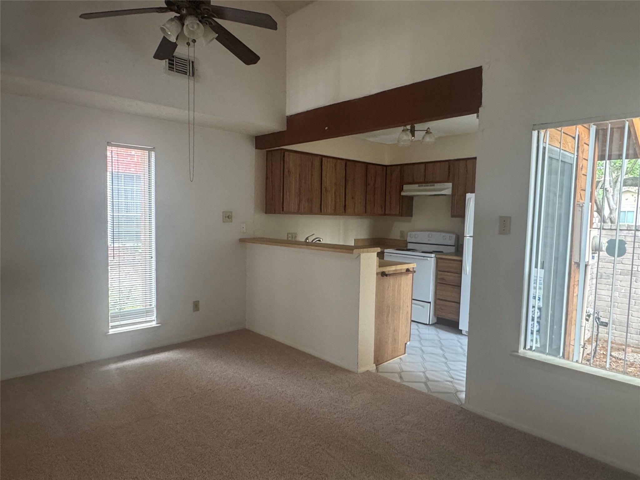 3020 Windchase Boulevard Houston, TX 77082 - Photo 7 of 16 a view of a kitchen with a sink and dishwasher a refrigerator with wooden floor