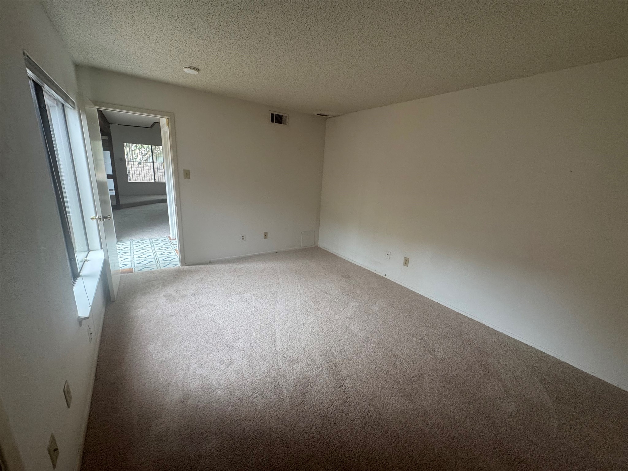 3020 Windchase Boulevard Houston, TX 77082 - Photo 8 of 16 an empty room with a bathroom