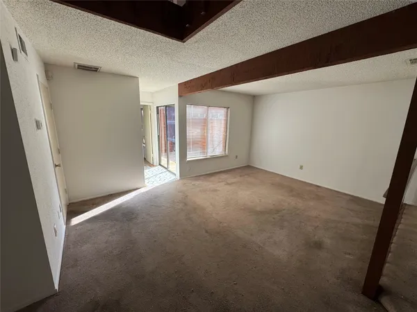 a view of a hallway with staircase
