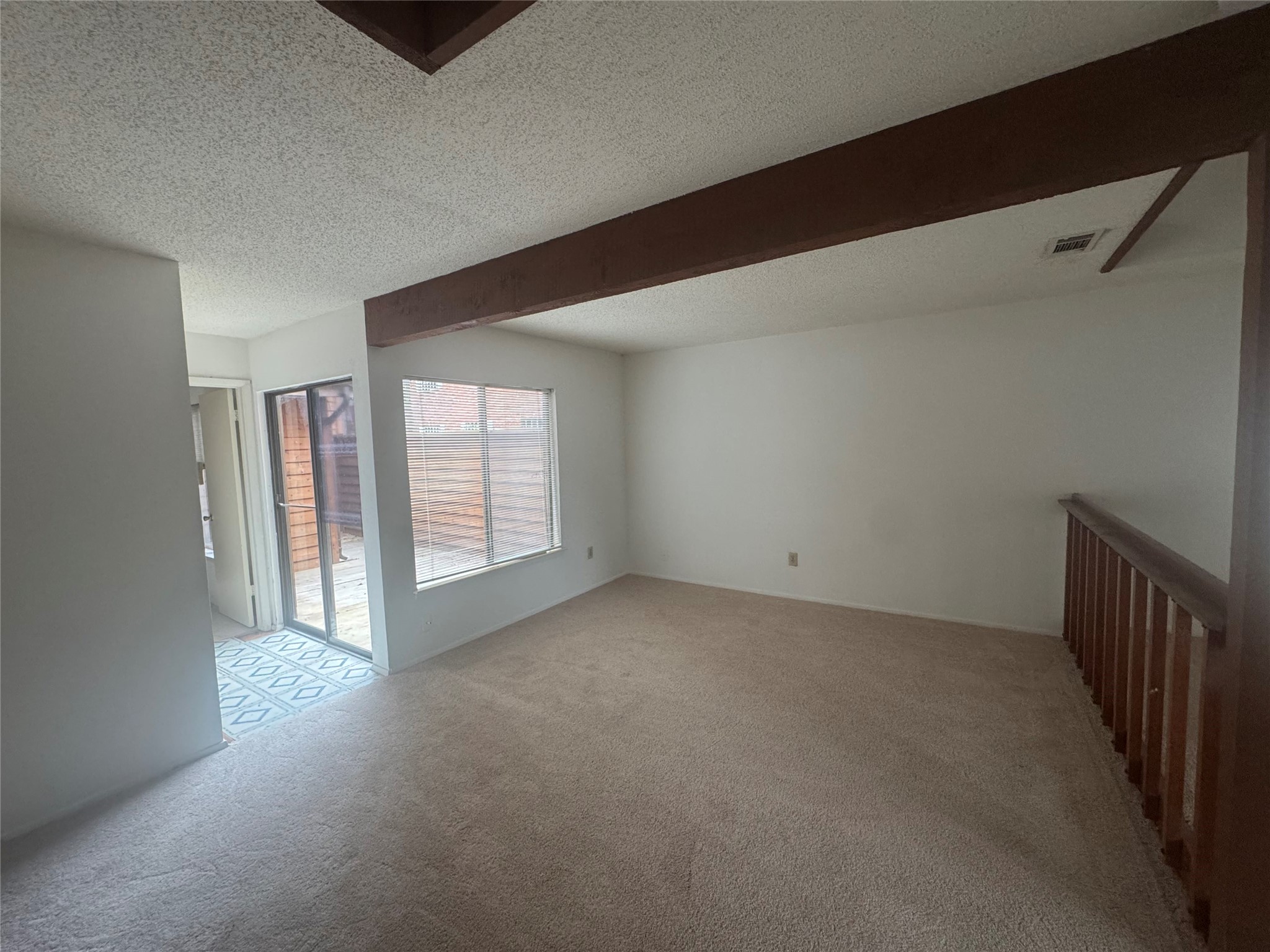 3020 Windchase Boulevard Houston, TX 77082 - Photo 9 of 16 a view of a livingroom with an empty space and a window