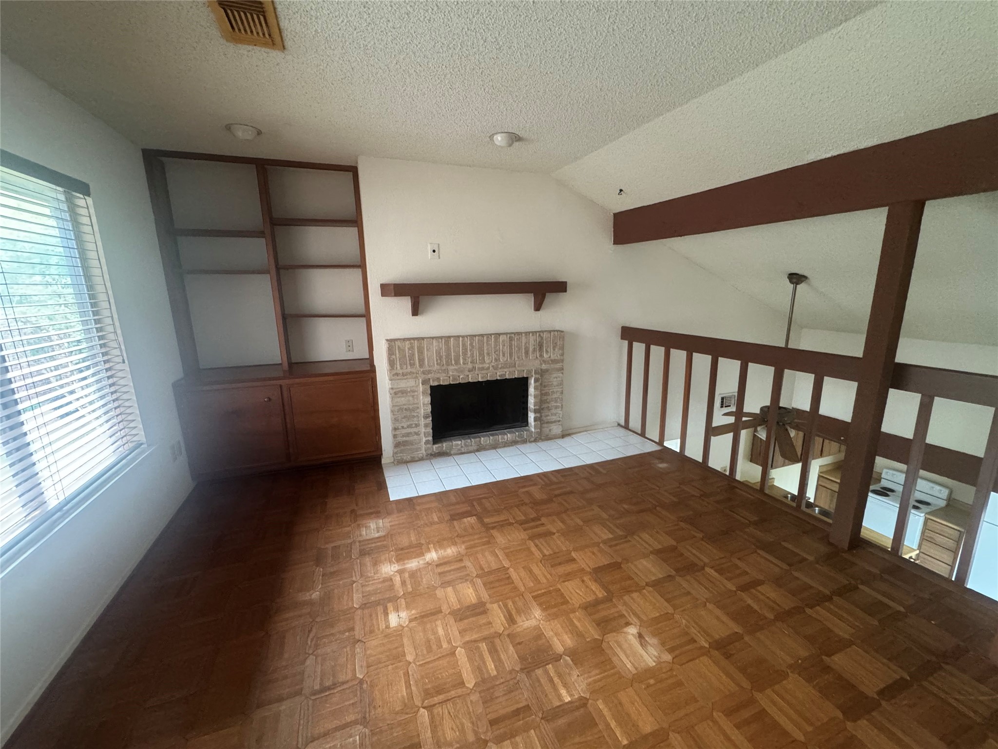 3020 Windchase Boulevard Houston, TX 77082 - Photo 10 of 16 a view of empty room with fireplace and windows