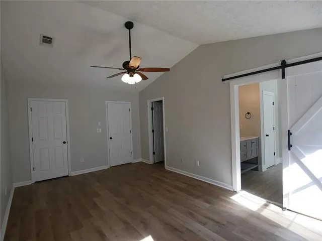 a view of a livingroom with a chandelier fan