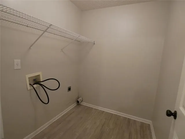 a view of a room with a ceiling fan