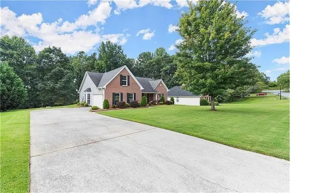 a front view of a house with garden