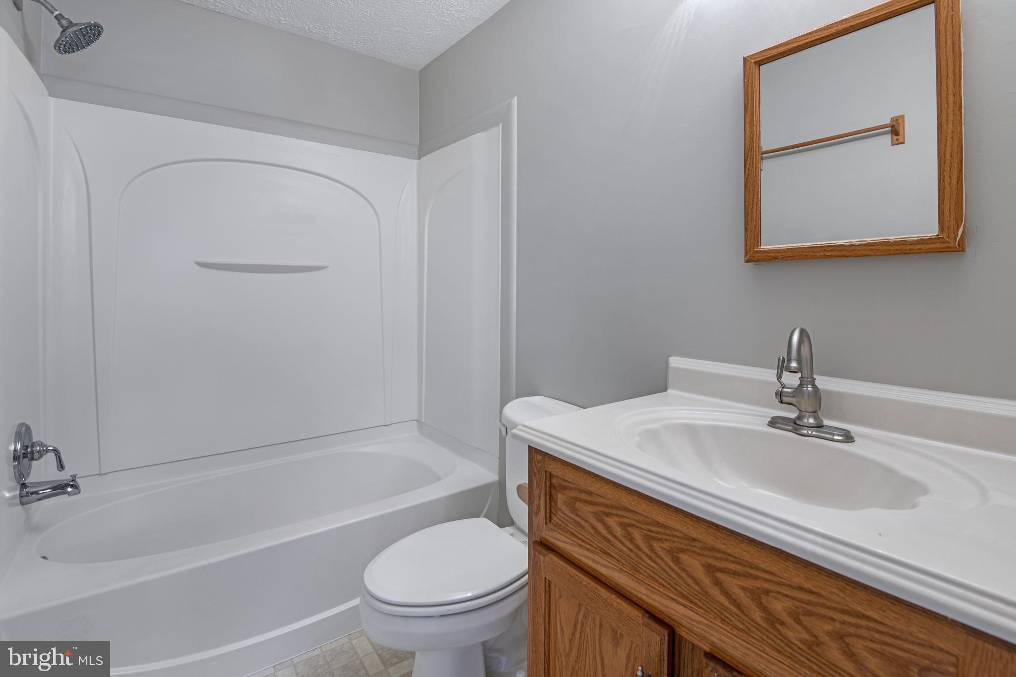 1824 Lawnview Drive Frederick, MD 21702 - Photo 10 of 21 a bathroom with a sink a toilet and shower