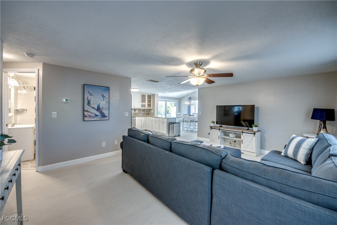 12262 Boat Shell Drive Matlacha Isles, FL 33991 - Photo 15 of 39 a living room with furniture and a flat screen tv
