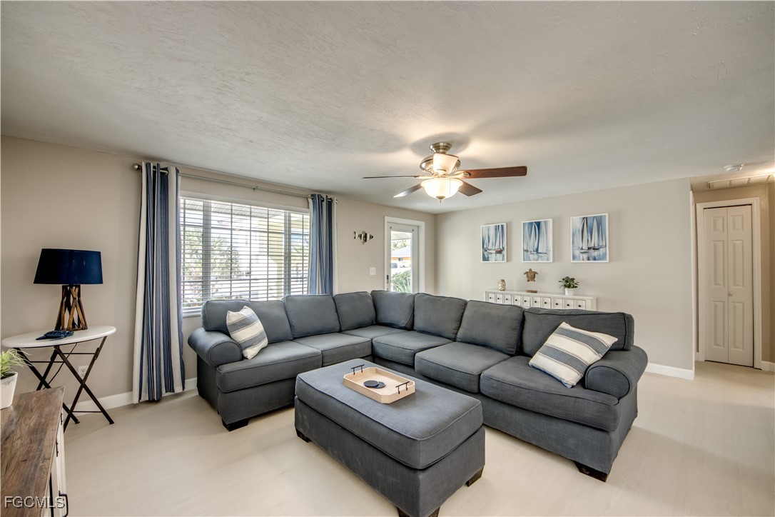 12262 Boat Shell Drive Matlacha Isles, FL 33991 - Photo 34 of 39 a living room with furniture and a large window