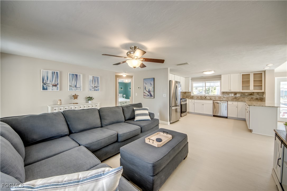 12262 Boat Shell Drive Matlacha Isles, FL 33991 - Photo 35 of 39 a living room with furniture and a view of kitchen