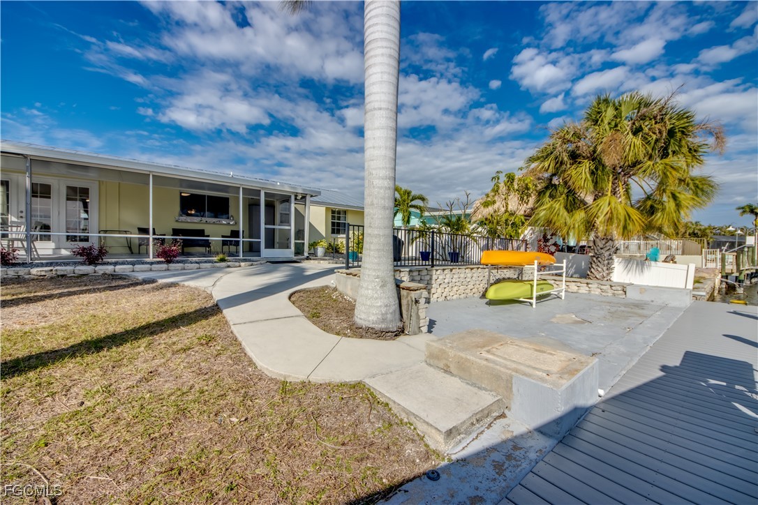 12262 Boat Shell Drive Matlacha Isles, FL 33991 - Photo 5 of 39 a view of a swimming pool with lounge chairs