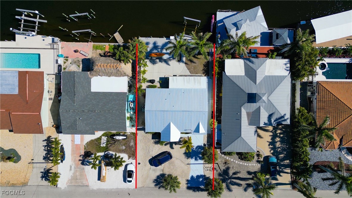 12262 Boat Shell Drive Matlacha Isles, FL 33991 - Photo 10 of 39 an aerial view of multiple houses with outdoor space