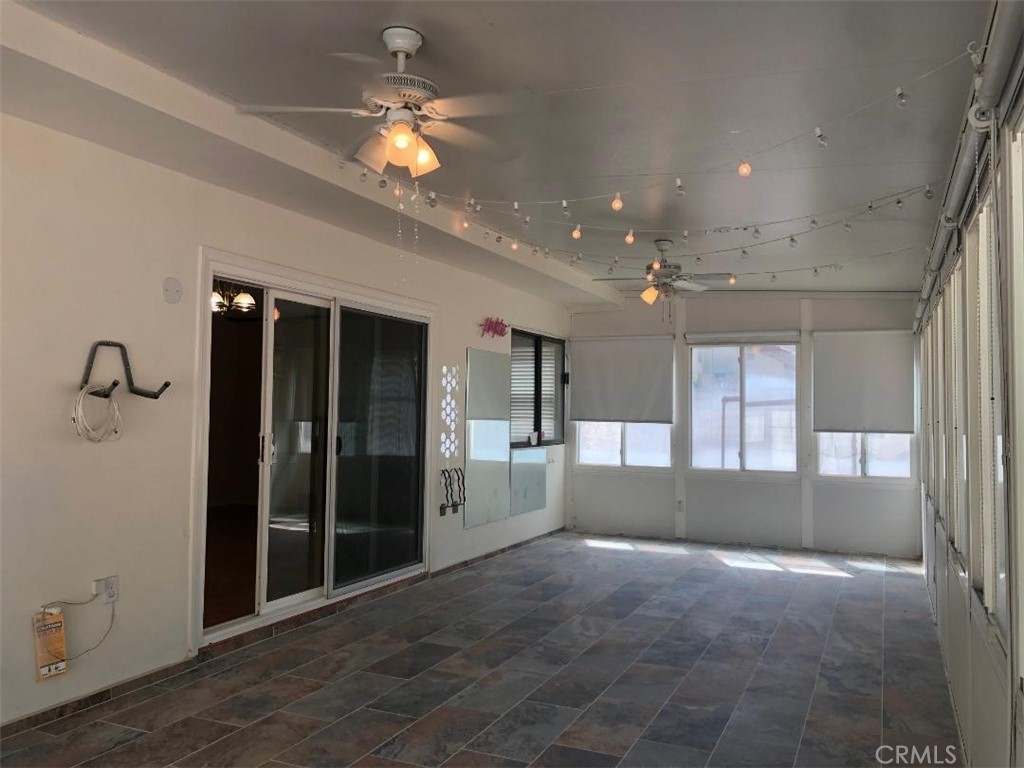 957 Silvertip Drive Diamond Bar, CA 91765 - Photo 11 of 14 a view of livingroom and kitchen with a ceiling fan and window