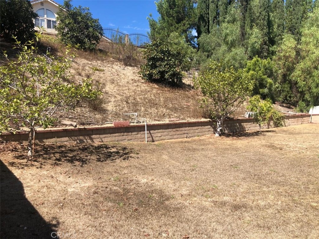 957 Silvertip Drive Diamond Bar, CA 91765 - Photo 14 of 14 a view of a yard with wooden fence