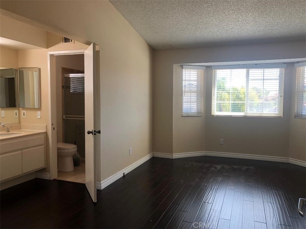 957 Silvertip Drive Diamond Bar, CA 91765 - Photo 8 of 14 wooden floor in an empty room with a window