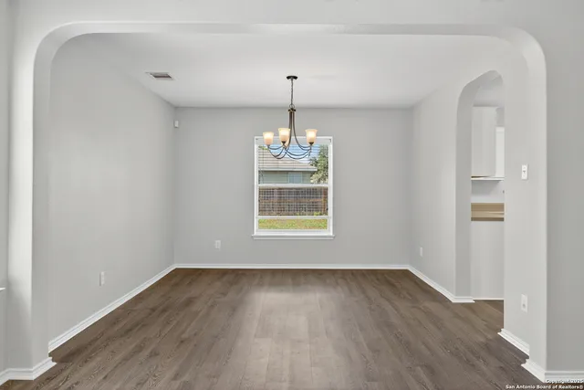 a room with window and wooden floor