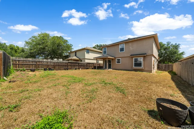a house with trees in the background