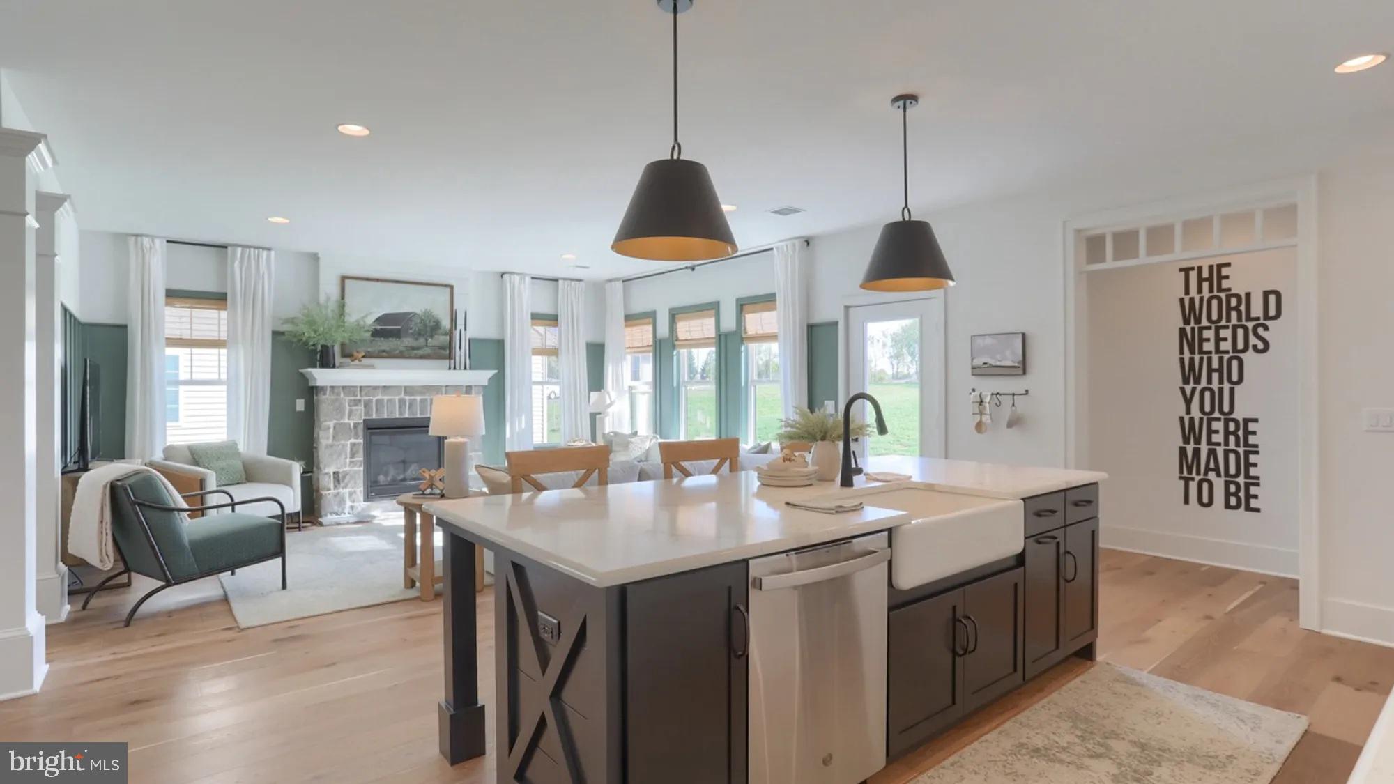 100 Flora Boulevard Lebanon, PA 17042 - Photo 11 of 24 a dining room with wooden floor a chandelier fan a wooden table and chairs