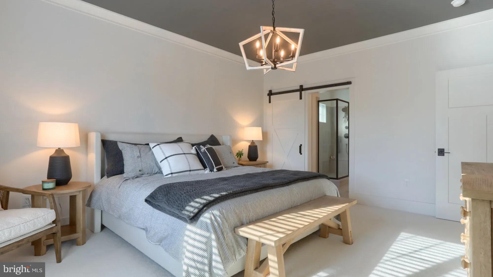 100 Flora Boulevard Lebanon, PA 17042 - Photo 16 of 24 a bedroom with a bed and a chandelier