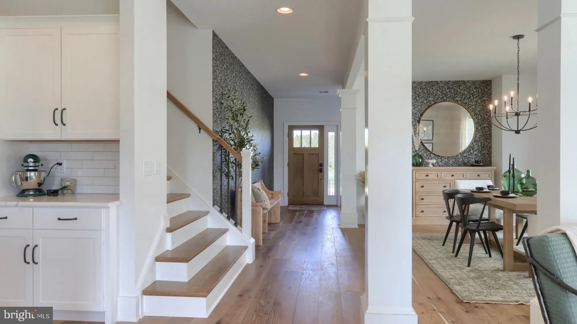 100 Flora Boulevard Lebanon, PA 17042 - Photo 3 of 24 a view of a hallway with dining area wooden floor and furniture