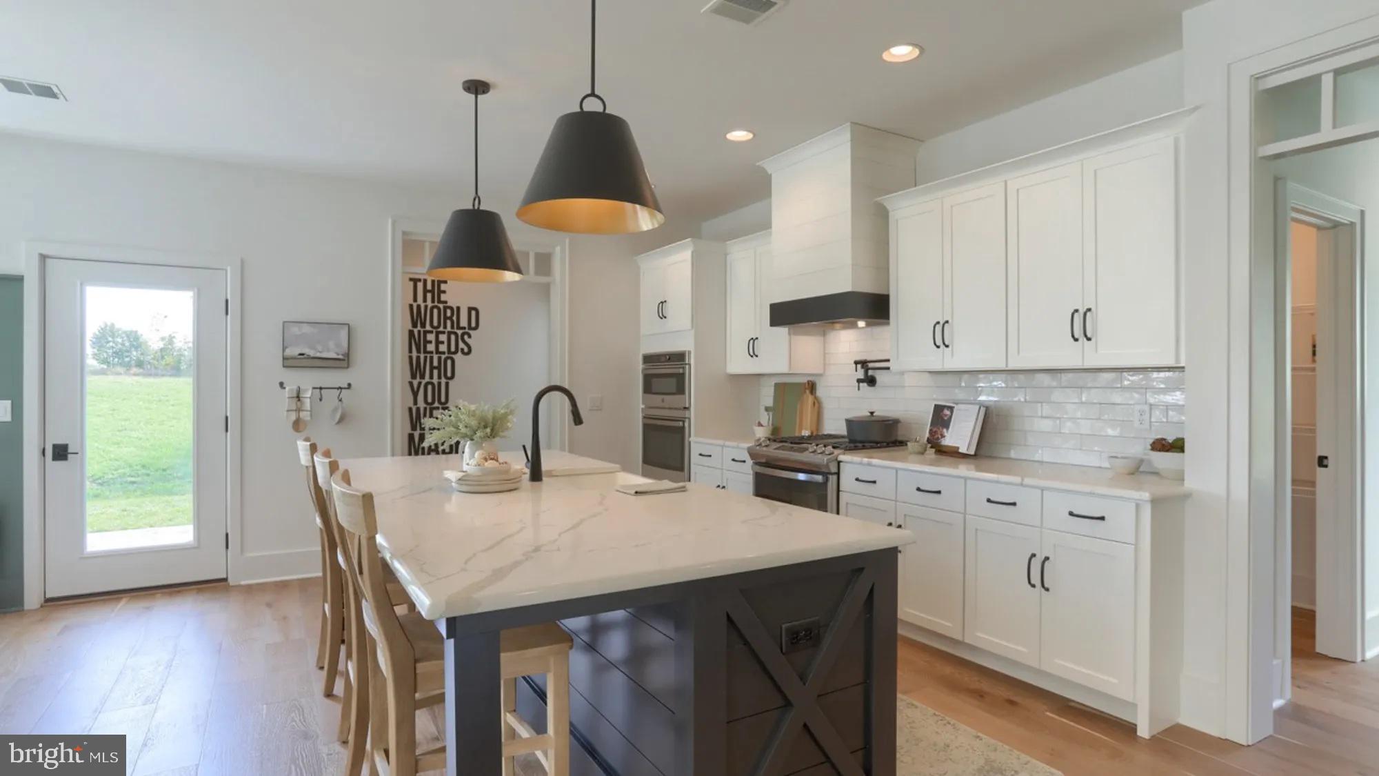 100 Flora Boulevard Lebanon, PA 17042 - Photo 8 of 24 a kitchen that has a lot of cabinets in it and wooden floors