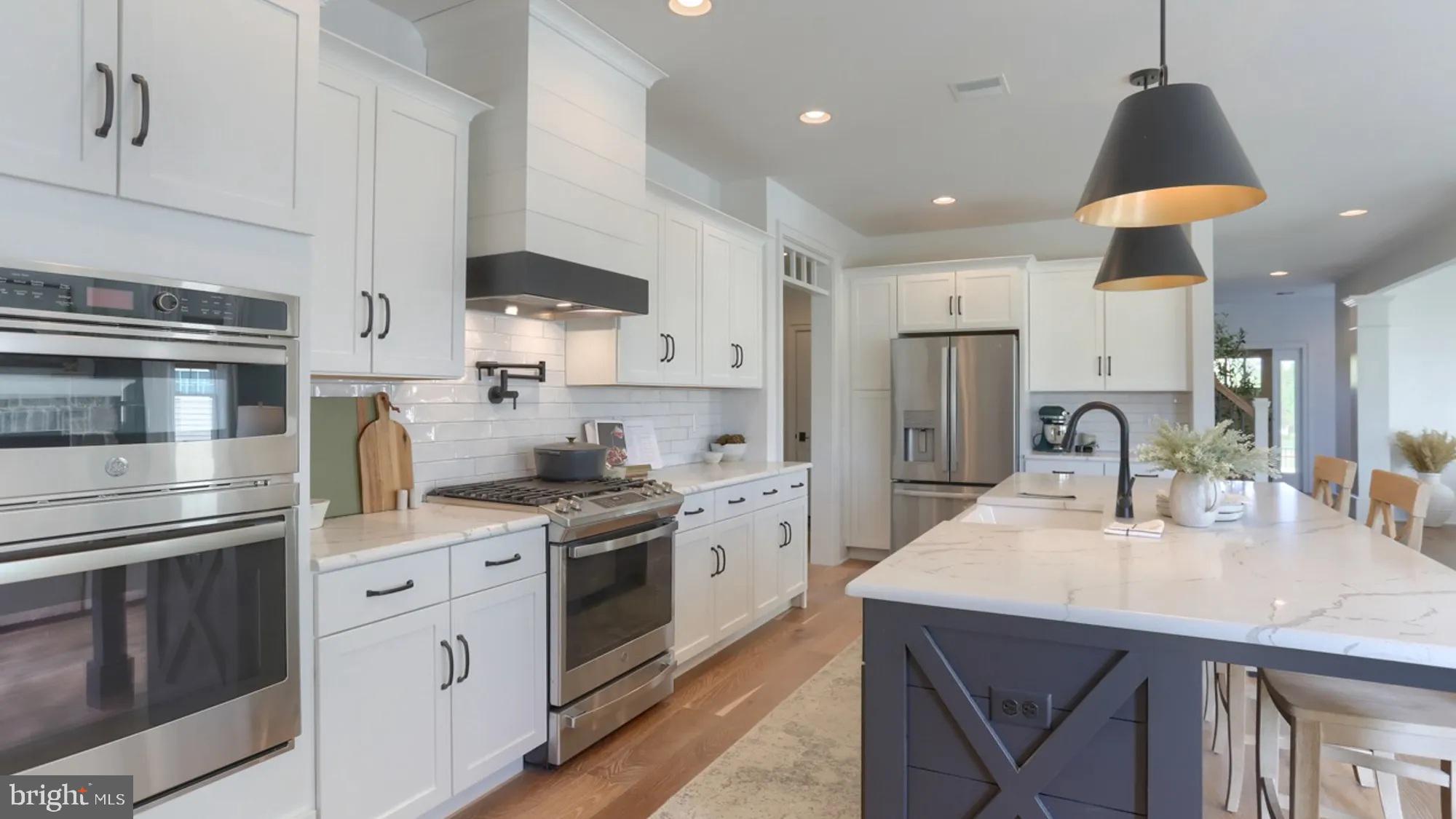 100 Flora Boulevard Lebanon, PA 17042 - Photo 10 of 24 a kitchen with stainless steel appliances granite countertop a sink a stove and a refrigerator