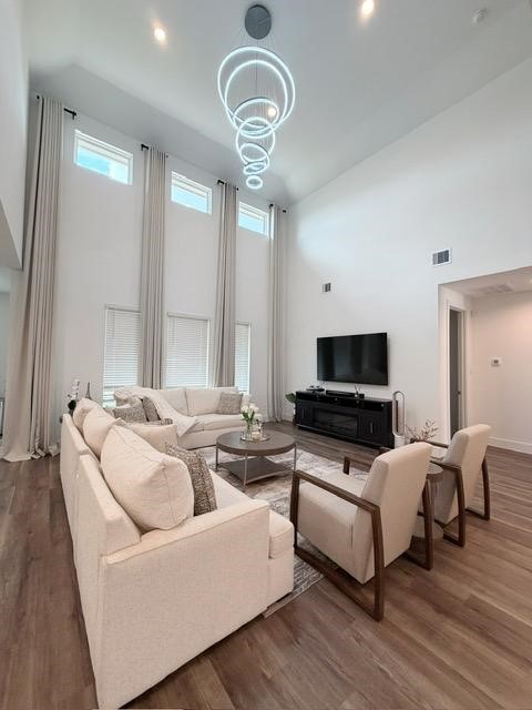 13725 Rising Sun Lane Conroe, TX 77384 - Photo 5 of 29 a living room with furniture and a flat screen tv