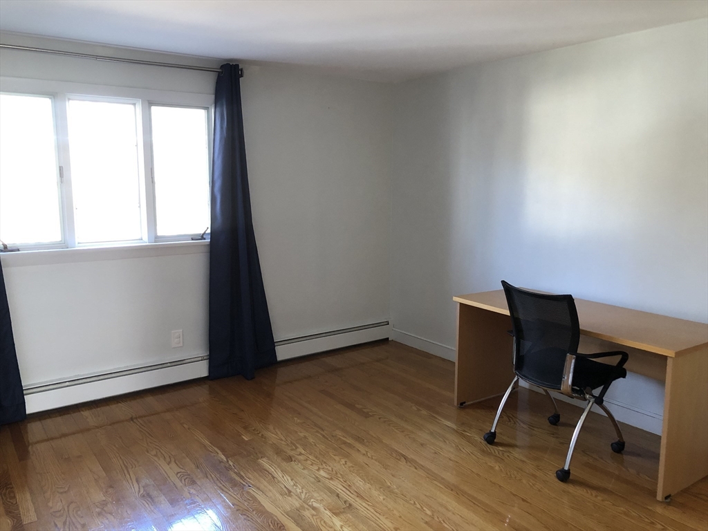 15 Sycamore Road Wakefield, MA 01880 - Photo 17 of 39 a view of a workspace with furniture and a window