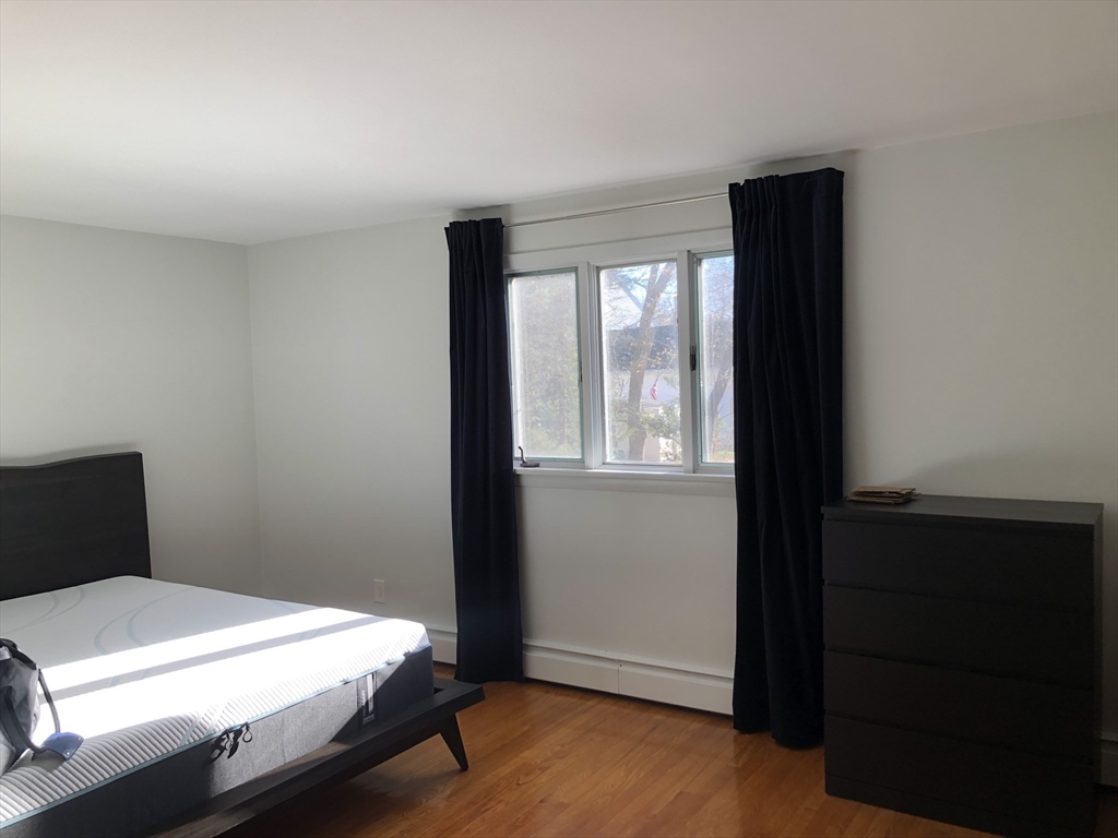 15 Sycamore Road Wakefield, MA 01880 - Photo 19 of 39 a bedroom with a bed and a window