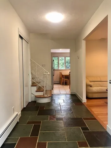 a living room with a furniture and a rug