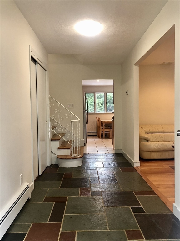 15 Sycamore Road Wakefield, MA 01880 - Photo 3 of 39 a living room with a furniture and a rug